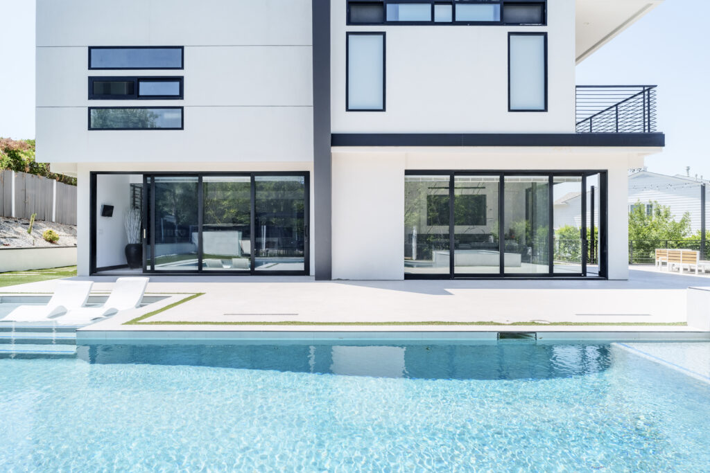 Modern aluminum bifold doors open wide bringing natural light